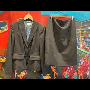 Nearly new Calvin Klein suit in a medium gray with light blue striping